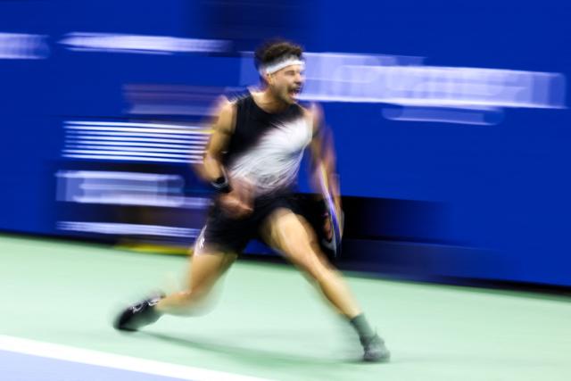 USA's Ben Shelton reacts after a point  against Spain's Carlos Alcaraz during the men's singles quarter-final tennis match on day ten of the US Open tennis tournament at the USTA Billie Jean King National Tennis Center in New York City on September 8, 2026. (Photo by CHARLY TRIBALLEAU / AFP)