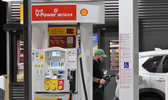 A driver fills his vehicle up with gas in Los Angeles, California on September 8, 2026. Oil prices climbed to near $100 a barrel in Asian morning trade, as the flare-up threatened to further choke supply from the crude-rich Middle East. (Photo by Frederic J. BROWN / AFP)