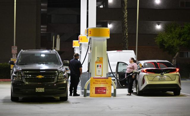 Drivers fill their vehicle with gasoline in Los Angeles, California on September 8, 2026. Oil prices climbed to near $100 a barrel in Asian morning trade, as the flare-up threatened to further choke supply from the crude-rich Middle East. (Photo by Frederic J. BROWN / AFP)