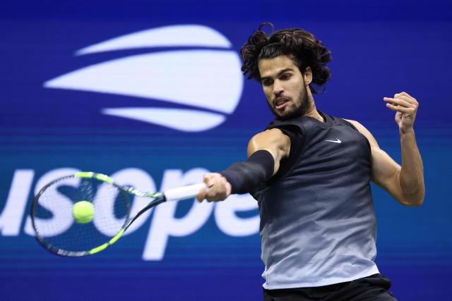 Spain's Carlos Alcaraz hits a return against USA's Ben Shelton during the men's singles quarter-final tennis match on day ten of the US Open tennis tournament at the USTA Billie Jean King National Tennis Center in New York City on September 9, 2026. (Photo by Leonardo MUNOZ / AFP)