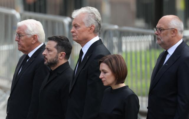 (L-R) German President Frank-Walter Steinmeier, Ukraine's President Volodymyr Zelensky, Lithuania's President Gitanas Nauseda, Moldova's President Maia Sandu and Estonia's President Alar Karis arrive at the church as they walk during the royal procession accompanying the casket of late King Harald V of Norway from the Royal Palace Chapel to the Cathedral in Oslo, Norway, on September 9, 2026. Harald, who died on August 28, 2026 at the age of 89, will be laid to rest in the crypt of the royal mausoleum of Akershus Castle, a medieval fortress overlooking Oslo Fjord, after a service at the Oslo Cathedral. (Photo by Odd ANDERSEN / AFP)