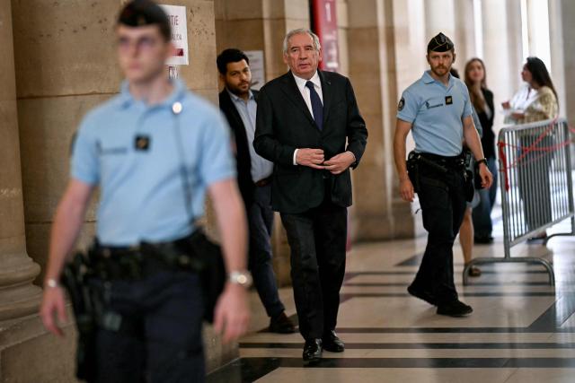 French politician Francois Bayrou arrives at Paris' courthouse for the opening of his appeal trial with twelve other defendants over the alleged misuse of European Parliament funds to pay fictitious parliamentary assistants for the centrist party MoDem, in Paris on September 9, 2026. Former Prime minister and MoDem founder François Bayrou and ten former party executives must answer, starting September 9, 2026, before the Paris appeal court for misappropriation of funds in the case of the MEP assistants, a ten-year-old case in which the former Prime Minister had been acquitted at first instance. (Photo by LOU BENOIST / AFP)