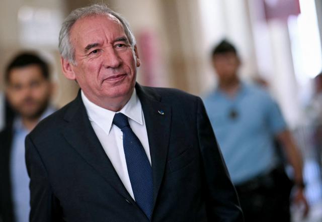 French politician Francois Bayrou arrives at Paris' courthouse for the opening of his appeal trial with twelve other defendants over the alleged misuse of European Parliament funds to pay fictitious parliamentary assistants for the centrist party MoDem, in Paris on September 9, 2026. Former Prime minister and MoDem founder François Bayrou and ten former party executives must answer, starting September 9, 2026, before the Paris appeal court for misappropriation of funds in the case of the MEP assistants, a ten-year-old case in which the former Prime Minister had been acquitted at first instance. (Photo by LOU BENOIST / AFP)