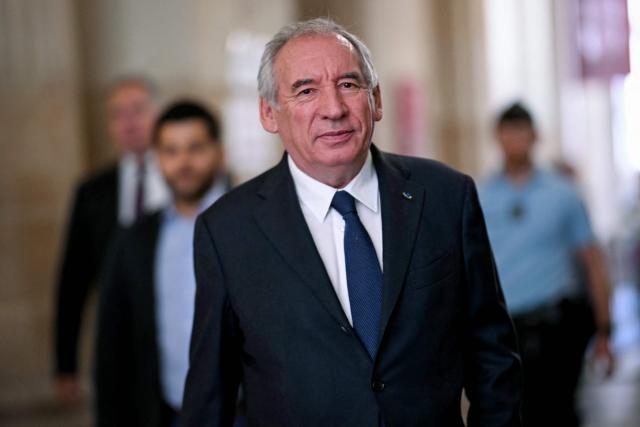 French politician Francois Bayrou arrives at Paris' courthouse for the opening of his appeal trial with twelve other defendants over the alleged misuse of European Parliament funds to pay fictitious parliamentary assistants for the centrist party MoDem, in Paris on September 9, 2026. Former Prime minister and MoDem founder François Bayrou and ten former party executives must answer, starting September 9, 2026, before the Paris appeal court for misappropriation of funds in the case of the MEP assistants, a ten-year-old case in which the former Prime Minister had been acquitted at first instance. (Photo by LOU BENOIST / AFP)