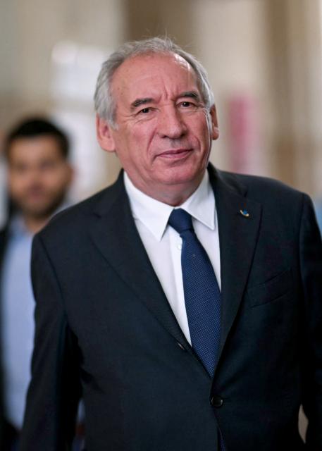 French politician Francois Bayrou arrives at Paris' courthouse for the opening of his appeal trial with twelve other defendants over the alleged misuse of European Parliament funds to pay fictitious parliamentary assistants for the centrist party MoDem, in Paris on September 9, 2026. Former Prime minister and MoDem founder François Bayrou and ten former party executives must answer, starting September 9, 2026, before the Paris appeal court for misappropriation of funds in the case of the MEP assistants, a ten-year-old case in which the former Prime Minister had been acquitted at first instance. (Photo by LOU BENOIST / AFP)