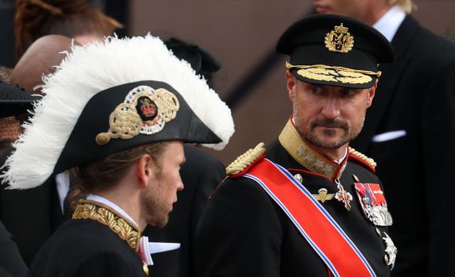 King Haakon VIII of Norway (R) speaks with Lord Chamberlain and Chief of the Royal Court of Norway Olav Heian-Engdal (L) after the funeral service for late King Harald V of Norway before the casket is moved in a procession from Oslo Cathedral to Akershus Castle in Oslo, Norway, on September 9, 2026. (Photo by Odd ANDERSEN / AFP)