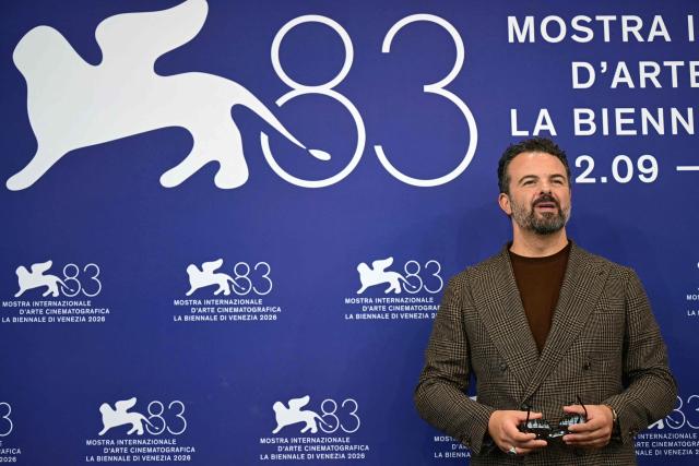 Director Edoardo De Angelis attends the photocall of "Il fuoco che ti porti dentro" (The Fire within you) presented in competition at the 83rd International Venice Film Festival, at Venice Lido on September 9, 2026. (Photo by Stefano Rellandini / AFP)