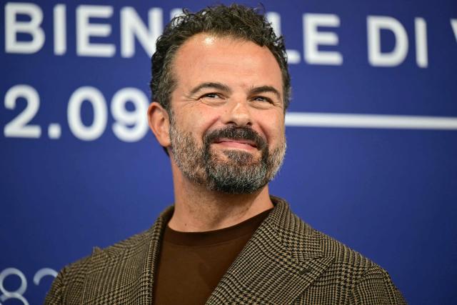 Director Edoardo De Angelis attends the photocall of "Il fuoco che ti porti dentro" (The Fire within you) presented in competition at the 83rd International Venice Film Festival, at Venice Lido on September 9, 2026. (Photo by Stefano Rellandini / AFP)