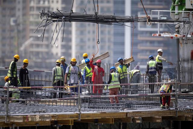 Labourers work at the construction site of a building in Dubai on September 9, 2026. (Photo by FADEL SENNA / AFP)