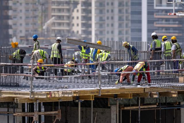 Labourers work at the construction site of a building in Dubai on September 9, 2026. (Photo by FADEL SENNA / AFP)