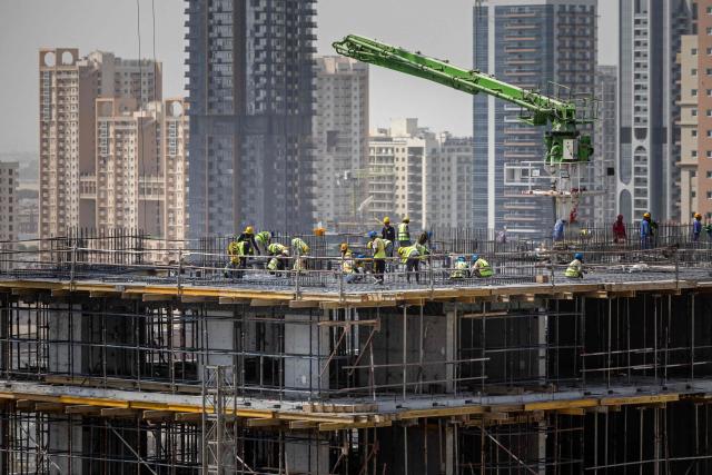 Labourers work at the construction site of a building in Dubai on September 9, 2026. (Photo by FADEL SENNA / AFP)