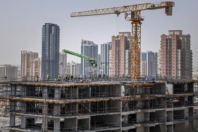 Labourers work at the construction site of a building in Dubai on September 9, 2026. (Photo by FADEL SENNA / AFP)