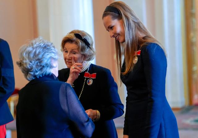 Queen Sonja of Norway (C) and Crown Princess Ingrid Alexandra of Norway (R) talk with a guest at the Royal Palace after the funeral of Norway's late King Harald V in Oslo, Norway, on September 9, 2026. Harald, who died on August 28, 2026 at the age of 89, was laid to rest in the crypt of the royal mausoleum of Akershus Castle, a medieval fortress overlooking Oslo Fjord, after a service at the Oslo Cathedral. Upon their return to the Royal Palace, Norway's new King and Queen and other members of the Royal Family are expected to appear on the Palace balcony. (Photo by Lise Åserud / POOL / AFP)