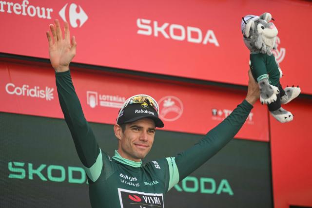 The leader of the points category, Team Visma-Lease a bike's Belgian rider Wout van Aert, celebrates on the podium following the 17th stage of the Vuelta a Espana 2026 cycling tour, a 185 km race between Dos Hermanas and Seville, on September 9, 2026. (Photo by JORGE GUERRERO / AFP)