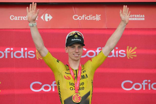 Team Visma-Lease a bike's British rider Matthew Brennan celebrates on the podium after winning the 17th stage of the Vuelta a Espana 2026 cycling tour, a 185 km race between Dos Hermanas and Seville, on September 9, 2026. (Photo by JORGE GUERRERO / AFP)