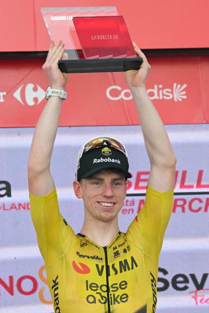 Team Visma-Lease a bike's British rider Matthew Brennan celebrates on the podium after winning the 17th stage of the Vuelta a Espana 2026 cycling tour, a 185 km race between Dos Hermanas and Seville, on September 9, 2026. (Photo by JORGE GUERRERO / AFP)
