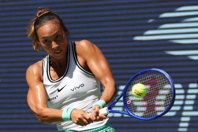 China's Qinwen Zheng hits a return to Kazakhstan's Elena Rybakina during their women's singles quarter-final tennis match on day eleven of the US Open tennis tournament at the USTA Billie Jean King National Tennis Center in New York on September 9, 2026. (Photo by TIMOTHY A. CLARY / AFP)
