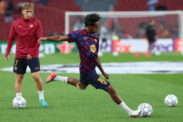 Barcelona's Spanish forward #10 Lamine Yamal kicks the ball during the warmup before the UEFA Champions League first round day 1 football match between FC Barcelona and Feyenoord at Camp Nou stadium in Barcelona on September 9, 2026. (Photo by Lluis GENE / AFP)