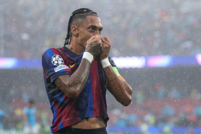 Barcelona's Brazilian forward #11 Raphinha (R) celebrates scoring his team's first goal during the UEFA Champions League first round day 1 football match between FC Barcelona and Feyenoord at Camp Nou stadium in Barcelona on September 9, 2026. (Photo by Lluis GENE / AFP)