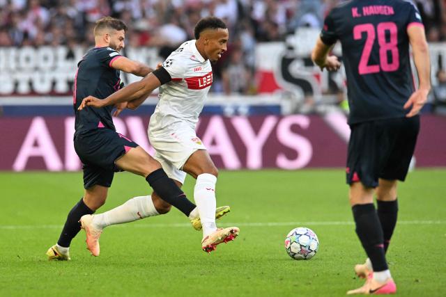 Stuttgart's German forward #18 Jamie Leweling (C) and Viking's Norwegian midfielder #10 Zlatko Tripic (L) vie for the ball during the UEFA Champions League, League phase, football match between VfB Stuttgart and Viking in Stuttgart, southern Germany, on September 9, 2026. (Photo by THOMAS KIENZLE / AFP)