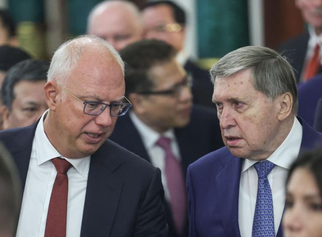 Kremlin foreign policy aide Yuri Ushakov (R) speaks with  Russia's presidential envoy Kirill Dmitriev (L) during the meeting of Russian and Vietnamese presidents in Moscow on September 9, 2026. (Photo by MAXIM SHIPENKOV / POOL / AFP)