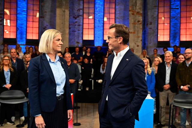 Candidates for Prime Minister, Magdalena Andersson (L) of the Social Democrats and Ulf Kristersson of The Moderates pose for photographers before an election debate in Gavle, Sweden, on September 9, 2026, ahead of the upcoming general election on September 13. (Photo by Anders WIKLUND / various sources / AFP) / Sweden OUT