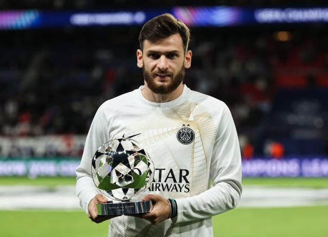 Paris Saint-Germain's Georgian forward #07 Khvicha Kvaratskhelia celebrates as he receives the UEFA Champions League Trophy for best player for the season 2025-2026 prior to the UEFA Champions League, league phase, matchday 1, football match between Paris Saint-Germain (PSG) and Slovan Bratislava at the Parc des Princes Stadium in Paris on September 9, 2026. (Photo by Anne-Christine POUJOULAT / AFP)