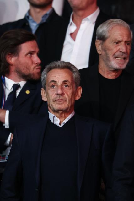 France's former president Nicolas Sarkozy reacts as he attends the UEFA Champions League, league phase, matchday 1, football match between Paris Saint-Germain (PSG) and Slovan Bratislava at the Parc des Princes Stadium in Paris on September 9, 2026. (Photo by FRANCK FIFE / AFP)
