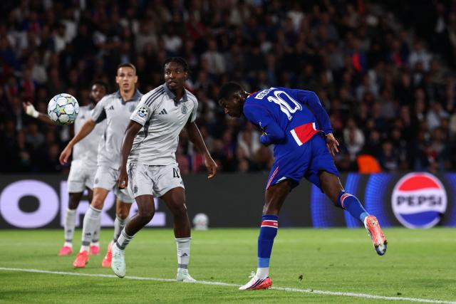 Paris Saint-Germain's French forward #10 Ousmane Dembele (L) heads the ball to score his team second goal during the UEFA Champions League, league phase, matchday 1, football match between Paris Saint-Germain (PSG) and Slovan Bratislava at the Parc des Princes Stadium in Paris on September 9, 2026. (Photo by FRANCK FIFE / AFP)