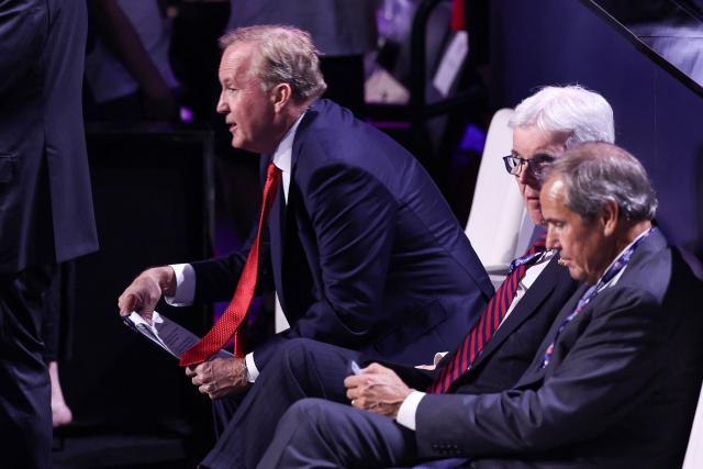 (L/R) Texas Attorney General Ken Paxton, candidate for US Senate, takes his seat next to Texas Lieutenant Governor Dan Patrick during the first day of the Republican National Midterm Convention at the American Airlines Center in Dallas, Texas on September 9, 2026. US Republicans open an extraordinary midterm convention in Dallas on September 9 betting that putting Donald Trump at the center of their campaign can rescue a party facing grim election forecasts -- despite the president's negative approval ratings. (Photo by Blake Fagan / AFP)