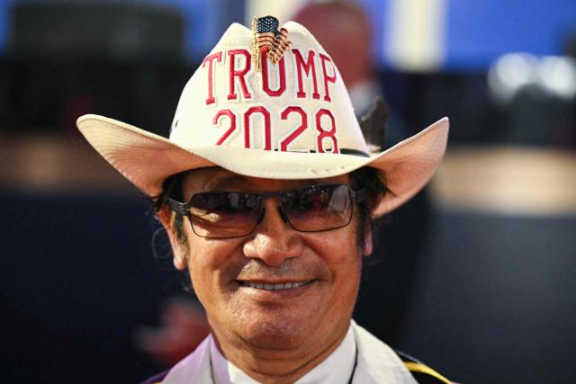 An attendee wears a "Trump 2028" hat during first day of the Republican National Midterm Convention at the American Airlines Center in Dallas, Texas on September 9, 2026. US Republicans open an extraordinary midterm convention in Dallas on September 9 betting that putting Donald Trump at the center of their campaign can rescue a party facing grim election forecasts -- despite the president's negative approval ratings. (Photo by RONALDO SCHEMIDT / AFP)