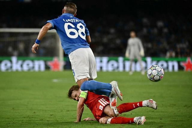 Napoli's Slovak midfielder #68 Stanislav Lobotka and Arsenal's Norwegian midfielder #08 Martin Odegaard fight for the ball during the UEFA Champions League - League Phase, Matchday 1 - football match between Napoli and Arsenal at the Stadio Diego Armando Maradona in Naples on September 9, 2026. (Photo by Filippo MONTEFORTE / AFP)