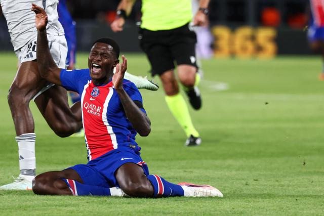 Paris Saint-Germain's Portuguese defender #25 Nuno Mendes reacts as he falls following a tackle during the UEFA Champions League, league phase, matchday 1, football match between Paris Saint-Germain (PSG) and Slovan Bratislava at the Parc des Princes Stadium in Paris on September 9, 2026. (Photo by FRANCK FIFE / AFP)