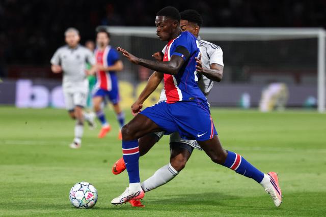 Paris Saint-Germain's Portuguese defender #25 Nuno Mendes and Guest during the UEFA Champions League, league phase, matchday 1, football match between Paris Saint-Germain (PSG) and Slovan Bratislava at the Parc des Princes Stadium in Paris on September 9, 2026. (Photo by FRANCK FIFE / AFP)