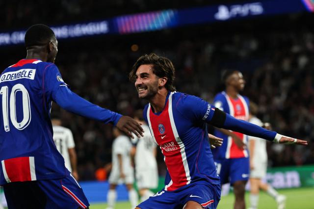 Paris Saint-Germain's Spanish forward #09 Ferran Torres (R) celebrates with Paris Saint-Germain's French forward #10 Ousmane Dembele (L) after scoring his team fifth goal during the UEFA Champions League, league phase, matchday 1, football match between Paris Saint-Germain (PSG) and Slovan Bratislava at the Parc des Princes Stadium in Paris on September 9, 2026. (Photo by Anne-Christine POUJOULAT / AFP)