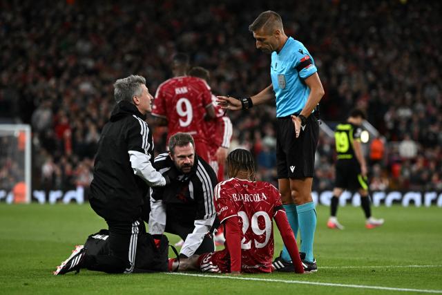 Liverpool's French midfielder #29 Bradley Barcola receives medical treatment during the UEFA Champions League football match between Liverpool and Atletico Madrid at Anfield in Liverpool, north west England on September 9, 2026. (Photo by Paul ELLIS / AFP)
