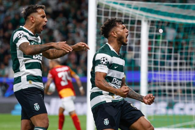 Sporting Lisbon's Colombian forward #97 Luis Suarez (R) celebrates scoring his team's second goal during the UEFA Champions League first round day 1 football match between Sporting CP and Galatasaray at Jose Alvalade stadium in Lisbon on September 9, 2026. (Photo by FILIPE AMORIM / AFP)