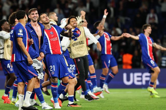 Paris Saint-Germain's Spanish midfielder #08 Fabian Ruiz (C) celebrates with teammates after winning at the end of the UEFA Champions League, league phase, matchday 1, football match between Paris Saint-Germain (PSG) and Slovan Bratislava at the Parc des Princes Stadium in Paris on September 9, 2026. Paris Saint-Germain (PSG) wins 6 - 1 against Slovan Bratislava. (Photo by Anne-Christine POUJOULAT / AFP)
