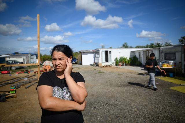 (FILES) A member of the Roma community looks on in the "La Prairie des Mauves" settlement in Nantes, western France, on August 31, 2026. Between 700 and 1,000 people, mostly Roma, live in the few "hamlets" of the Prairie de Mauves, to the east of Nantes – a haphazard collection of caravans and small houses made of mismatched planks, where pieces of wood and abandoned furniture are piled up in a jumble. Not far from the tracks of the Nantes–Angers line, the shacks in the Moulin des Marees shantytown have been partly dismantled, the site littered with pieces of wood and overturned furniture. The evictions have been criticised both by the local right wing parties, which condemns a "piecemeal" approach, and by the Nantes branch of the French left-wing party La France Insoumise, which deplores what it calls organised "wandering". (Photo by Loic VENANCE / AFP)