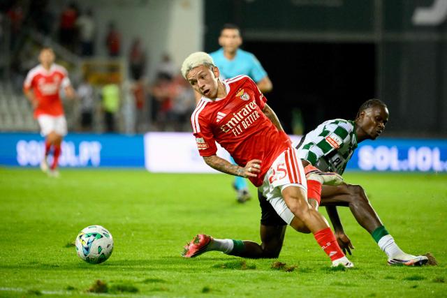 Benfica's Argentine forward #25 Gianluca Prestianni and Moreirense's Bissau-Guinean defender #66 Gilberto Batista fight for the ball during the Portuguese League football match between Moreirense FC and SL Benfica at Comendador Joaquim de Almeida Freitas stadium in Moreira de Conegos on September 9, 2026. (Photo by Miguel RIOPA / AFP)