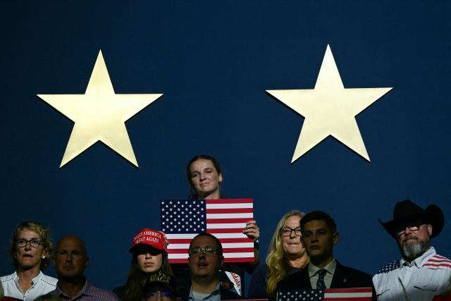 Attendees listen as US President Donald Trump speaks during the Republican National Midterm Convention at the American Airlines Center in Dallas, Texas on September 9, 2026. US Republicans open an extraordinary midterm convention in Dallas on September 9 betting that putting Donald Trump at the center of their campaign can rescue a party facing grim election forecasts -- despite the president's negative approval ratings. (Photo by Brendan SMIALOWSKI / AFP)
