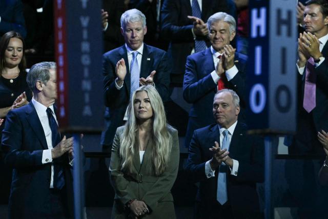 CEO of Turning Point USA Erika Kirk stands as she is acknowledged by US President Donald Trump during the Republican National Midterm Convention at the American Airlines Center in Dallas, Texas on September 9, 2026. US Republicans open an extraordinary midterm convention in Dallas on September 9 betting that putting Donald Trump at the center of their campaign can rescue a party facing grim election forecasts -- despite the president's negative approval ratings. (Photo by RONALDO SCHEMIDT / AFP)