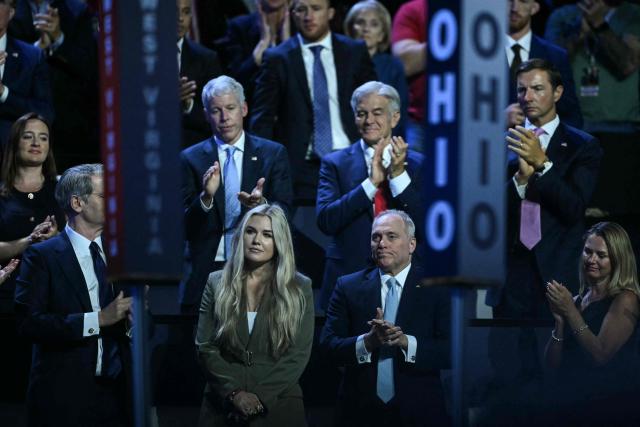 CEO of Turning Point USA Erika Kirk stands as she is acknowledged by US President Donald Trump during the Republican National Midterm Convention at the American Airlines Center in Dallas, Texas on September 9, 2026. US Republicans open an extraordinary midterm convention in Dallas on September 9 betting that putting Donald Trump at the center of their campaign can rescue a party facing grim election forecasts -- despite the president's negative approval ratings. (Photo by RONALDO SCHEMIDT / AFP)