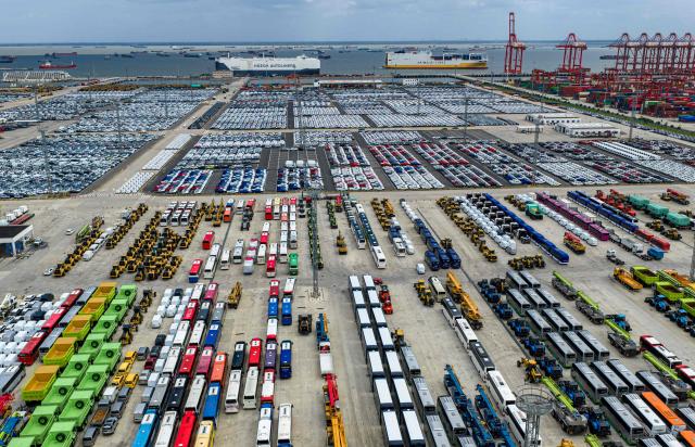 Cars and other vehicles are seen on a dock before being loaded onto ships for export at Suzhou port, in China’s eastern Jiangsu province on September 9, 2026. (Photo by CN-STR / AFP) / China OUT