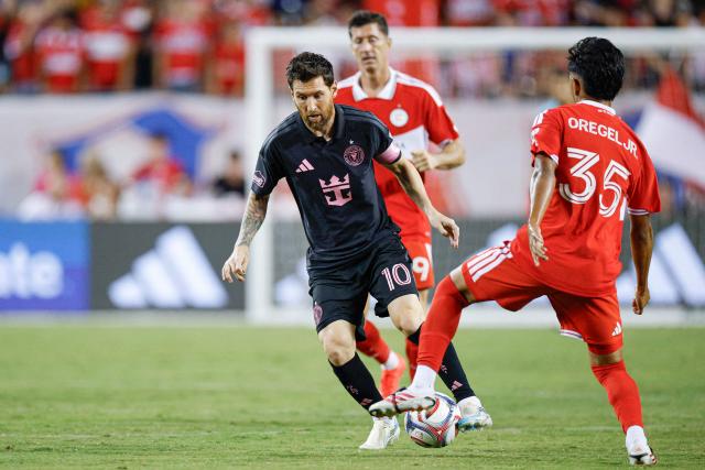 Inter Miami's Argentine forward #10 Lionel Messi controls the ball as he's defended by Chicago Fire's US midfielder #35 Sergio Oregel Jr. during a Major League Soccer (MLS) regular season football match between Inter Miami CF and Chicago Fire FC at Soldier Field in Chicago, Illinois, on September 9, 2026. (Photo by KAMIL KRZACZYNSKI / AFP)