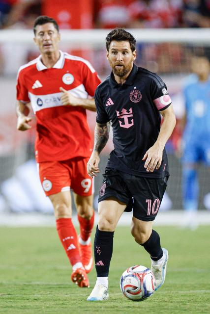 Inter Miami's Argentine forward #10 Lionel Messi controls the ball followed by Chicago Fire's Polish forward #09 Robert Lewandowski during a Major League Soccer (MLS) regular season football match between Inter Miami CF and Chicago Fire FC at Soldier Field in Chicago, Illinois, on September 9, 2026. (Photo by KAMIL KRZACZYNSKI / AFP)