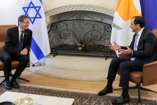 Cyprus' President Nikos Christodoulides (R) receives Israel's President Isaac Herzog (L) at the Presidential Palace in Nicosia on September 10, 2026. (Photo by Yiannis Kourtoglou / POOL / AFP)
