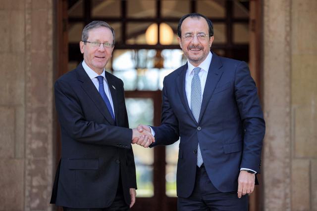 Cyprus' President Nikos Christodoulides (R) receives Israel's President Isaac Herzog (L) at the Presidential Palace in Nicosia on September 10, 2026. (Photo by Yiannis Kourtoglou / POOL / AFP)