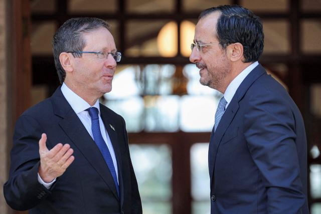 Cyprus' President Nikos Christodoulides (R) receives Israel's President Isaac Herzog (L) at the Presidential Palace in Nicosia on September 10, 2026. (Photo by Yiannis Kourtoglou / POOL / AFP)