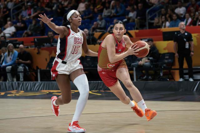 USA's forward #15 Angel Reese (L) and Hungary's small forward #13 Agnes Torok vie during the 2026 FIBA Women's Basketball World Cup quarter-final match between USA and Hungary at the Berlin Arena in Berlin on September 10, 2026. (Photo by Ronny HARTMANN / AFP)